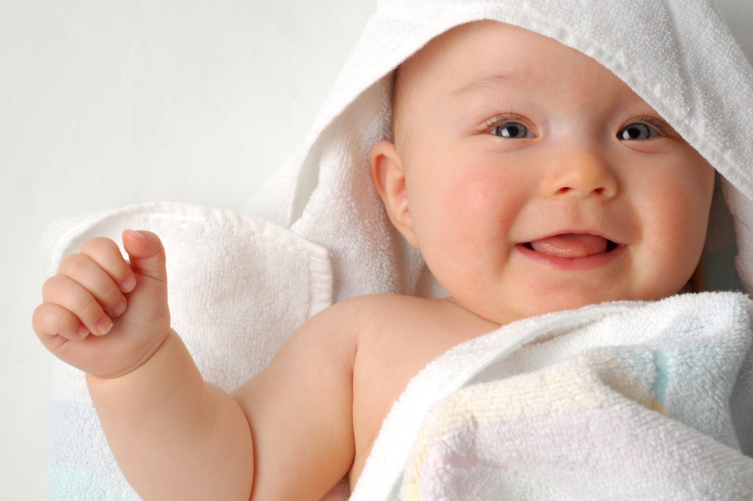 Happy Baby In white towel 